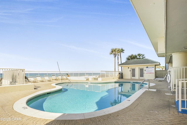 8601 Surf Dr Unit 14E, Panama City, FL 32408 - community pool with fence and a patio area