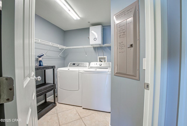 8601 Surf Dr Unit 14E, Panama City, FL 32408 - washroom featuring washer and dryer, light tile patterned flooring, and laundry area