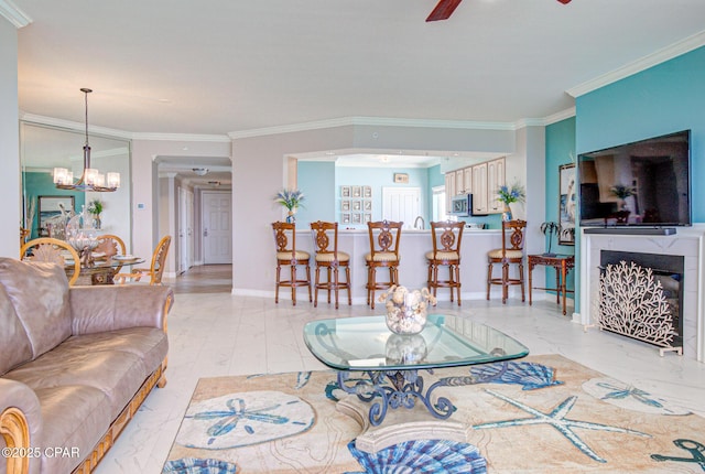 8601 Surf Dr Unit 14E, Panama City, FL 32408 - living area featuring crown molding, baseboards, ceiling fan with notable chandelier, and marble finish floor