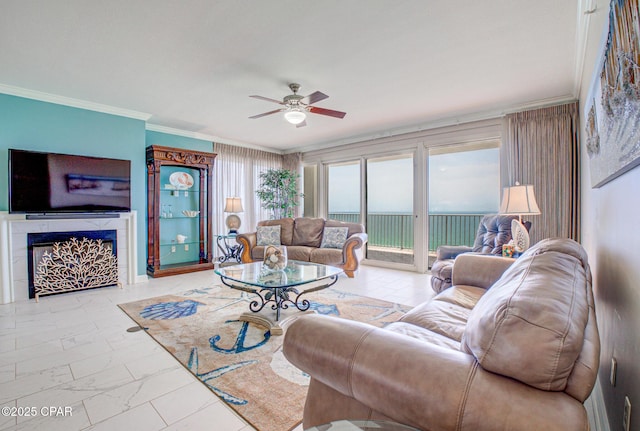 8601 Surf Dr Unit 14E, Panama City, FL 32408 - living room featuring ceiling fan, ornamental molding, marble finish floor, and a fireplace