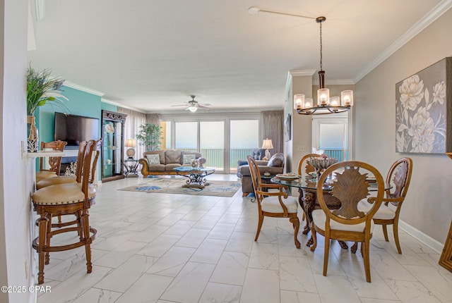 8601 Surf Dr Unit 14E, Panama City, FL 32408 - dining space with baseboards, ornamental molding, marble finish floor, and ceiling fan with notable chandelier
