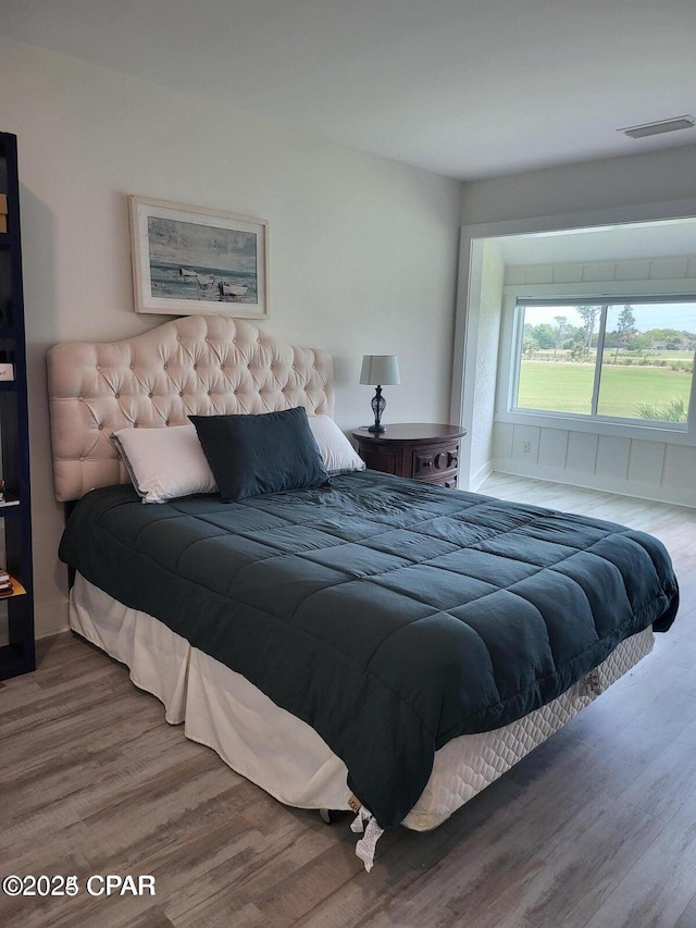 4725 Bay Point Rd Unit 262, Panama City Beach, FL 32408 - bedroom featuring visible vents and wood finished floors