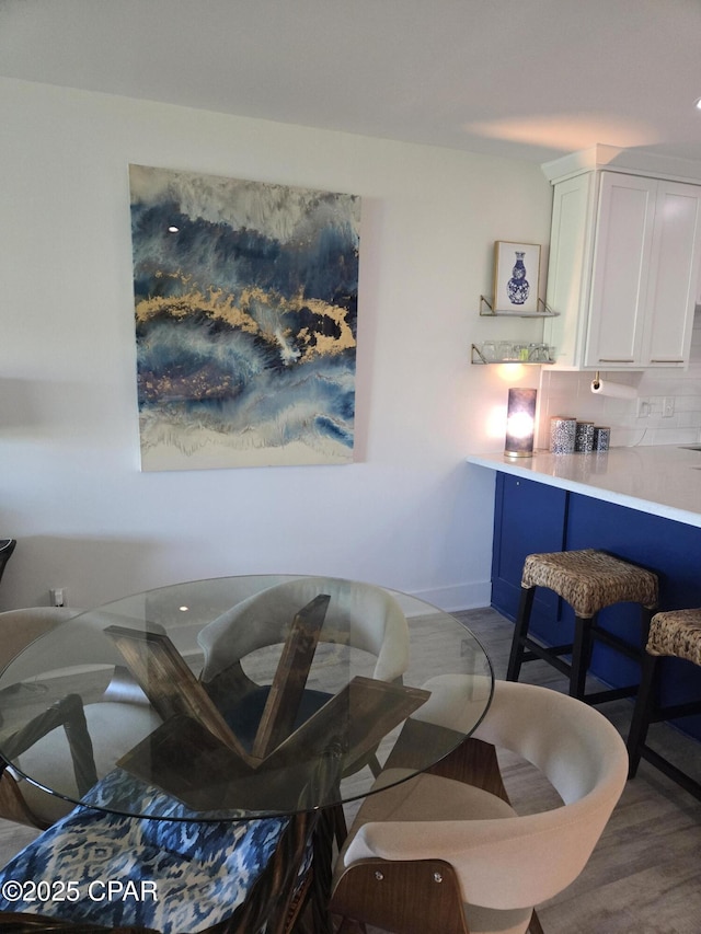 4725 Bay Point Rd Unit 262, Panama City Beach, FL 32408 - dining space featuring baseboards and wood finished floors