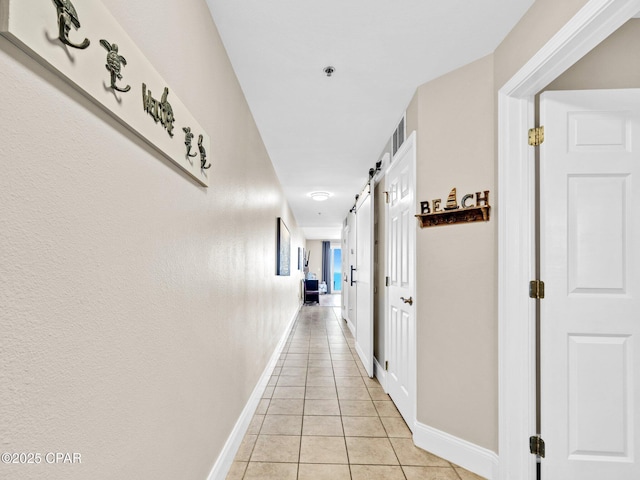 9860 S Thomas Dr Unit 1202, Panama City Beach, FL 32408 - hallway with light tile patterned flooring and baseboards