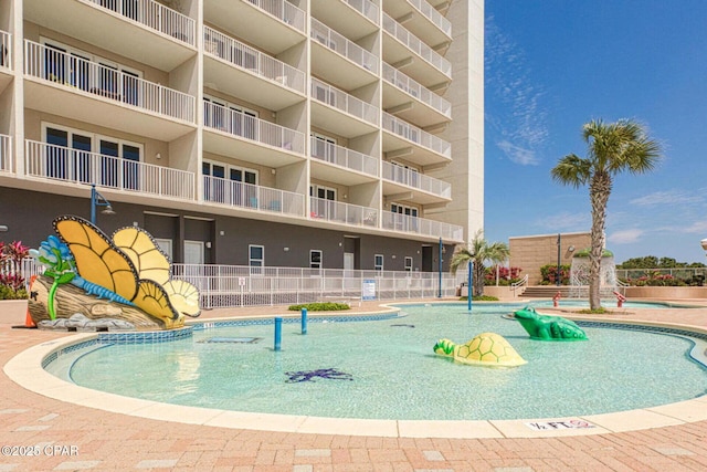 9860 S Thomas Dr Unit 1202, Panama City Beach, FL 32408 - community pool with fence and a water play area