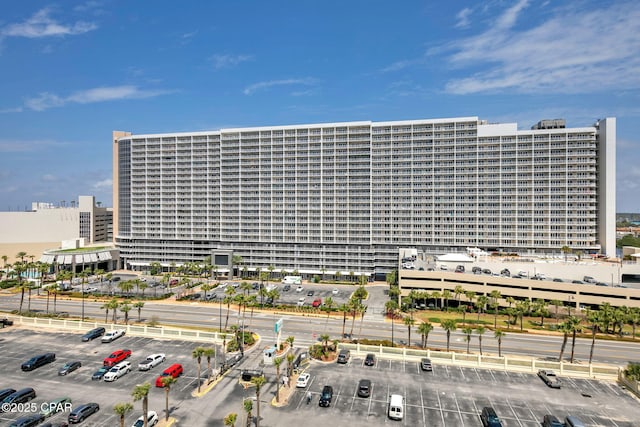 9860 S Thomas Dr Unit 1202, Panama City Beach, FL 32408 - view of building exterior featuring a view of city and uncovered parking