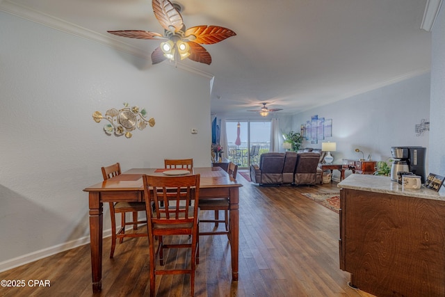 dining space featuring crown molding, ceiling fan, wood finished floors, and baseboards