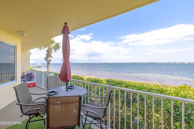 balcony featuring a water view