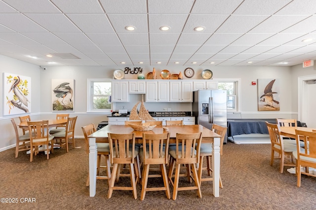 carpeted dining area with recessed lighting
