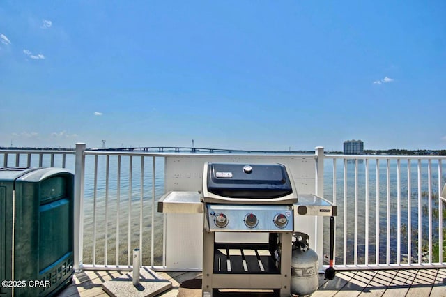 view of patio featuring a water view and grilling area