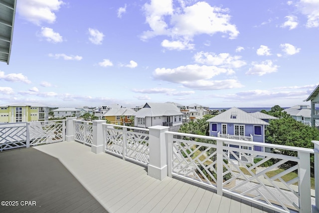 wooden deck featuring a residential view