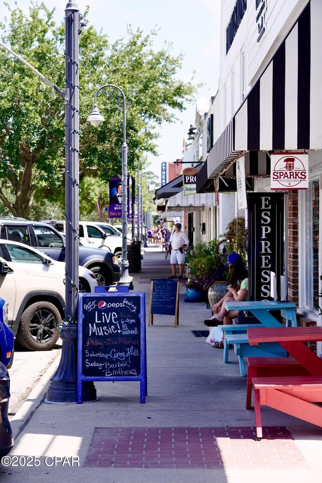 view of home's community featuring uncovered parking