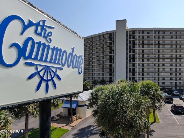 view of building exterior featuring uncovered parking