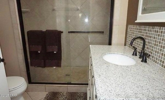 21022 Sweetwater Branch Rd, Fountain, FL 32438 - bathroom featuring a shower stall, vanity, tile patterned floors, and tasteful backsplash