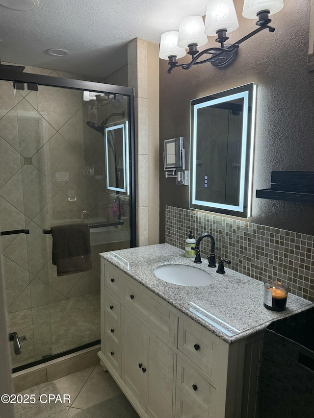 21022 Sweetwater Branch Rd, Fountain, FL 32438 - bathroom featuring vanity, a shower stall, tile patterned floors, and backsplash
