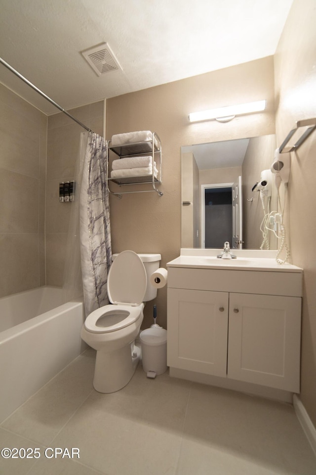 bathroom with toilet, tile patterned floors, vanity, and shower / bathtub combination with curtain