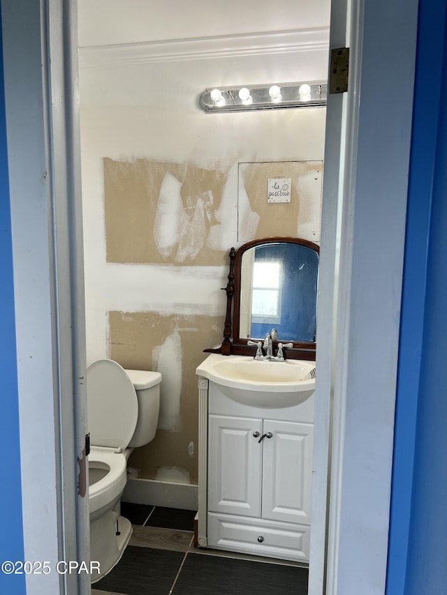 3906 W 24th Ct, Panama City, FL 32405 - bathroom featuring crown molding, toilet, tile patterned flooring, and vanity