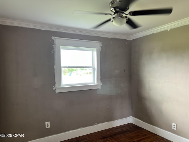 3906 W 24th Ct, Panama City, FL 32405 - spare room featuring crown molding, baseboards, ceiling fan, and dark wood-style floors
