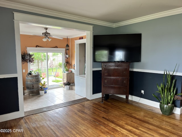 3906 W 24th Ct, Panama City, FL 32405 - living room with wood-type flooring, crown molding, baseboards, and ceiling fan