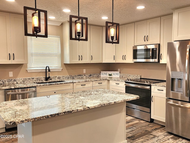 609 E Pine Forest Dr, Lynn Haven, FL 32444 - kitchen featuring a kitchen island, dark wood-style floors, recessed lighting, a sink, and stainless steel appliances