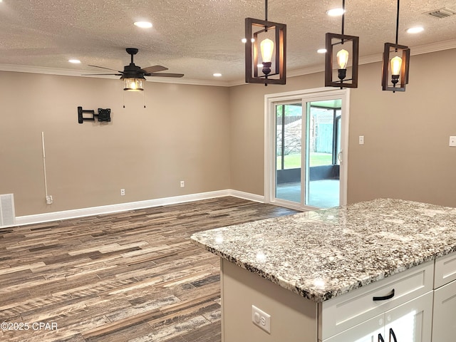 609 E Pine Forest Dr, Lynn Haven, FL 32444 - kitchen featuring ornamental molding, a ceiling fan, dark wood-type flooring, and visible vents