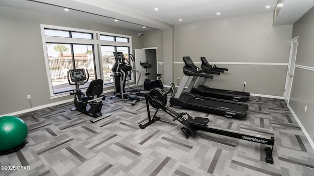 exercise room featuring recessed lighting, baseboards, and carpet