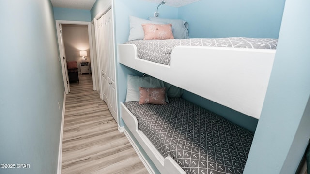 bedroom with wood finished floors