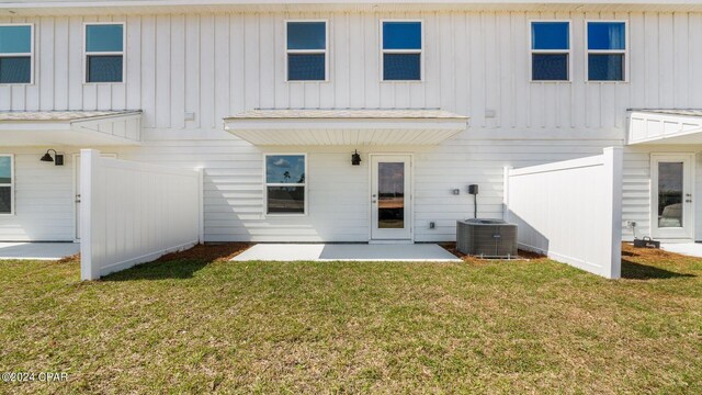 268 Salt Creek Ln, Mexico Beach, FL 32456 - back of house featuring board and batten siding, a patio, and central AC