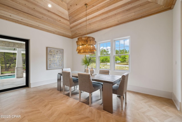 dining area with high vaulted ceiling, a chandelier, recessed lighting, baseboards, and wood ceiling