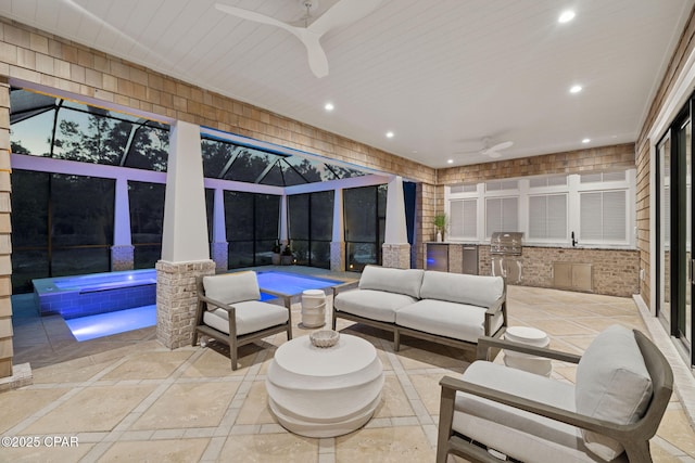 view of patio / terrace featuring grilling area, an in ground hot tub, an outdoor living space, ceiling fan, and exterior kitchen