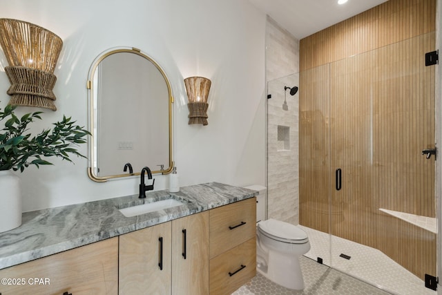full bath featuring toilet, recessed lighting, a shower stall, and vanity