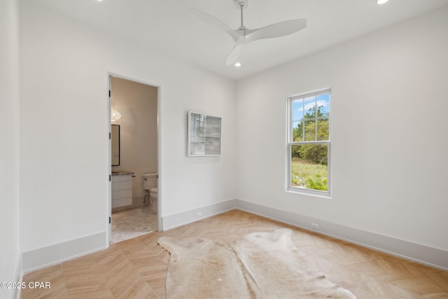 empty room with baseboards, recessed lighting, and a ceiling fan