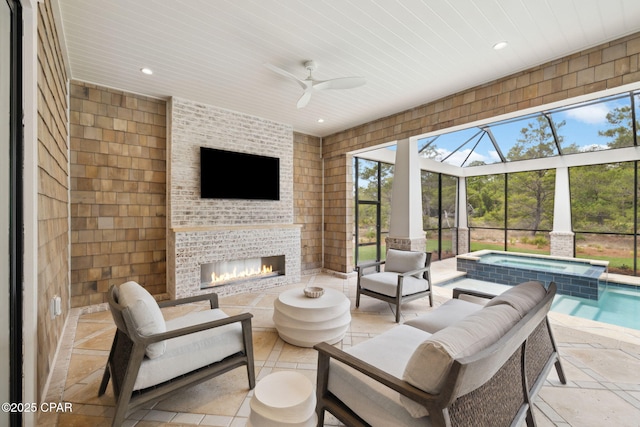 view of patio / terrace featuring a ceiling fan, an outdoor brick fireplace, a pool with connected hot tub, and glass enclosure