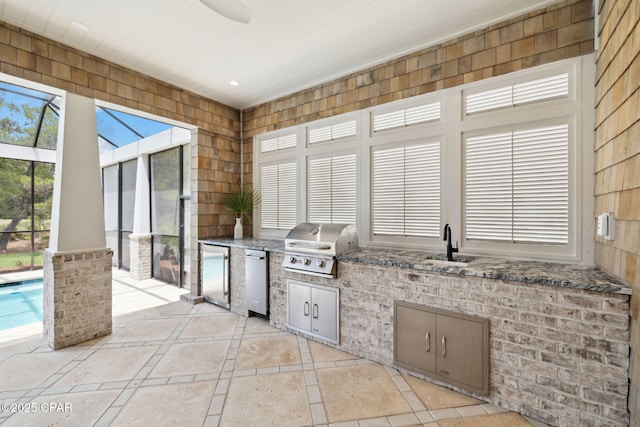 view of patio / terrace featuring a sink, grilling area, a ceiling fan, exterior kitchen, and glass enclosure