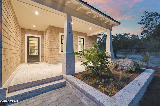 doorway to property with a porch