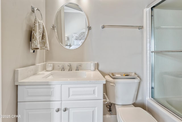 full bath featuring toilet, vanity, and bath / shower combo with glass door