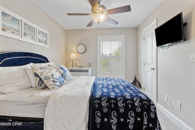 bedroom with carpet floors, baseboards, and a ceiling fan