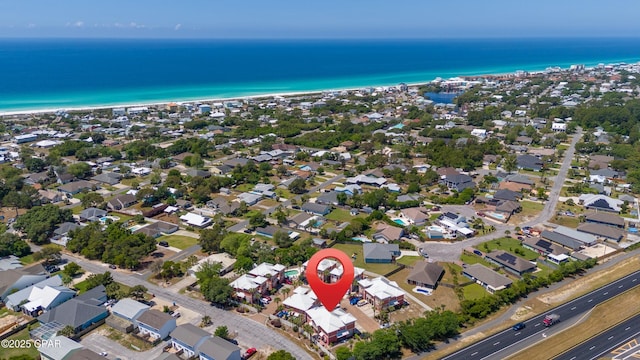 drone / aerial view with a water view and a residential view
