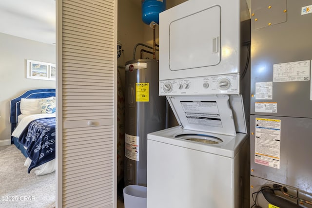 laundry room with heating unit, carpet, stacked washer / dryer, laundry area, and water heater