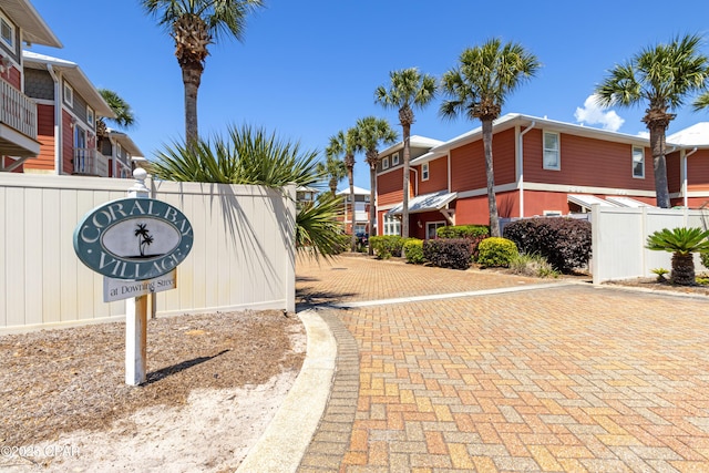 surrounding community featuring fence and a residential view