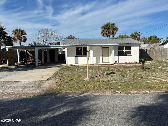 3733 Benbow St, Panama City Beach, FL 32408 - ranch-style house with an attached carport, concrete driveway, and metal roof