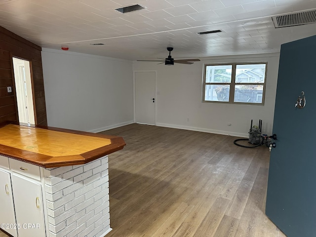 3733 Benbow St, Panama City Beach, FL 32408 - unfurnished living room with a ceiling fan, wood finished floors, and baseboards