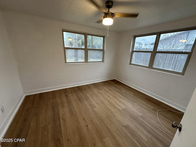 3733 Benbow St, Panama City Beach, FL 32408 - empty room featuring baseboards, wood finished floors, and ceiling fan