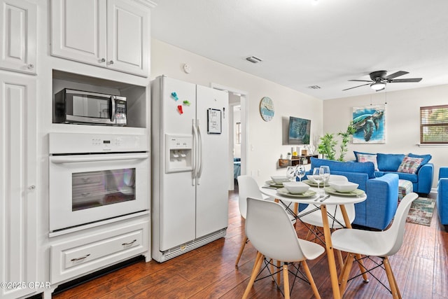4025 Venus St, Panama City Beach, FL 32408 - dining space with ceiling fan, dark wood finished floors, and visible vents