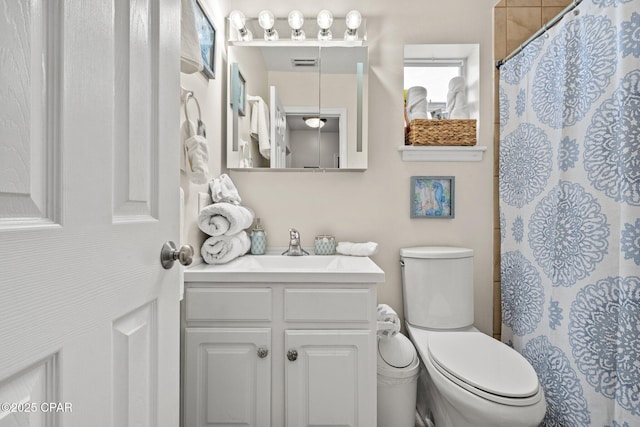 4025 Venus St, Panama City Beach, FL 32408 - full bath with toilet, vanity, visible vents, and a shower with shower curtain