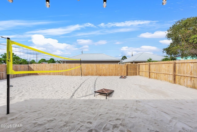 4025 Venus St, Panama City Beach, FL 32408 - surrounding community with a fenced backyard and volleyball court