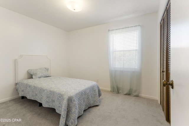 3947 Verona Cir, Panama City, FL 32405 - bedroom featuring baseboards, light colored carpet, and a closet