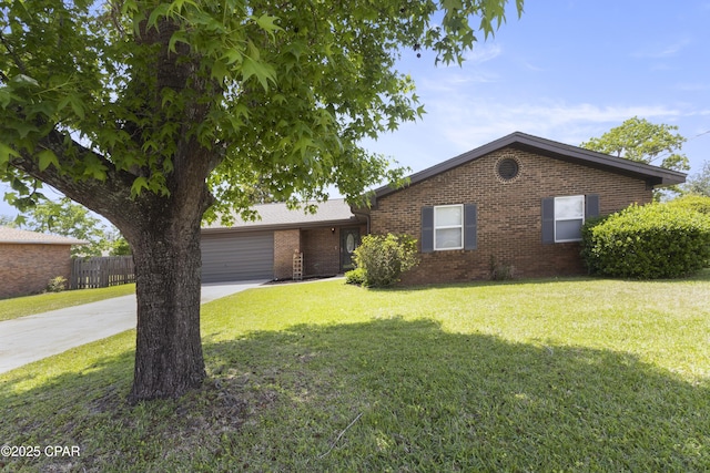 3947 Verona Cir, Panama City, FL 32405 - ranch-style home featuring fence, an attached garage, a front lawn, brick siding, and concrete driveway