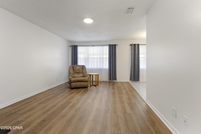 3947 Verona Cir, Panama City, FL 32405 - living area with visible vents, light wood-style flooring, and baseboards