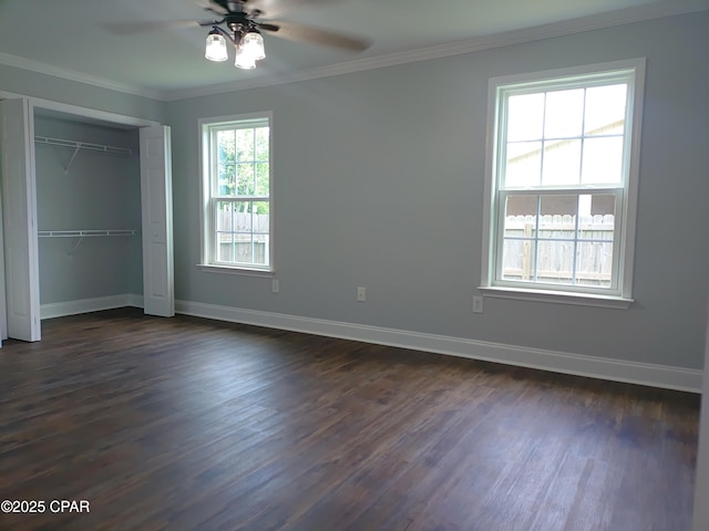 2525 E 40th Ct, Panama City, FL 32405 - unfurnished bedroom featuring baseboards, ornamental molding, dark wood-style floors, and a closet